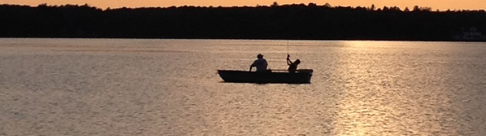 Keith Smith and his grandson fishing during a Upper Michigan sunset