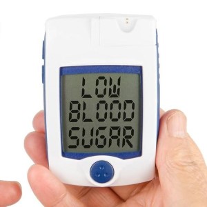 Blood sugar tester displaying 'LOW BLOOD SUGAR.'