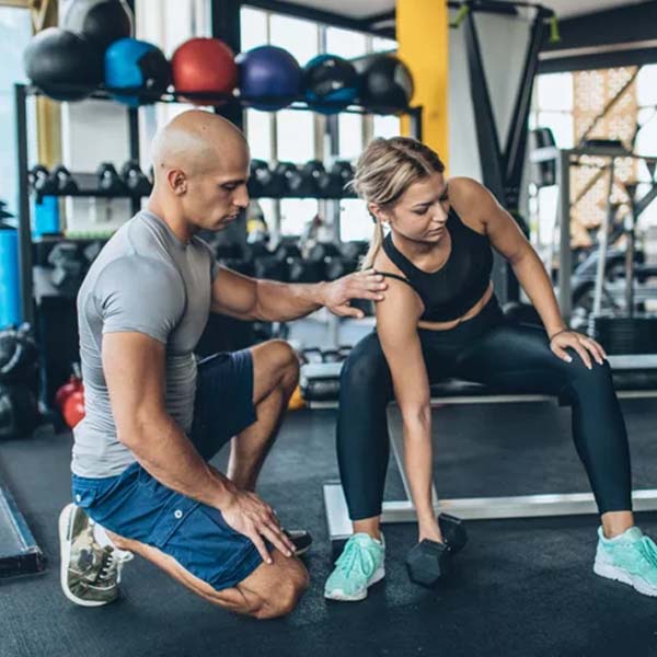 Workout partners lifting weights.